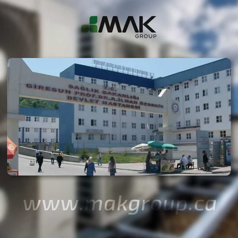 White multi-storey facility with an entrance courtyard