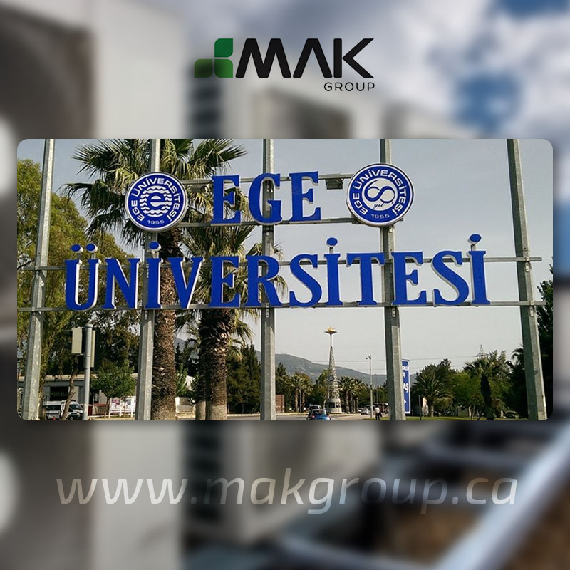 University entrance sign among trees